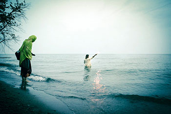 It Comes In Waves - Dan in the water with flare